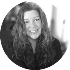 Black and white, circle-cropped headshot of Heather Traum, Founder and Project Manager